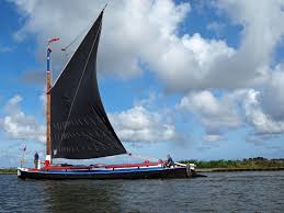 A wherry boat with the distinctive shaped sails wherry boat